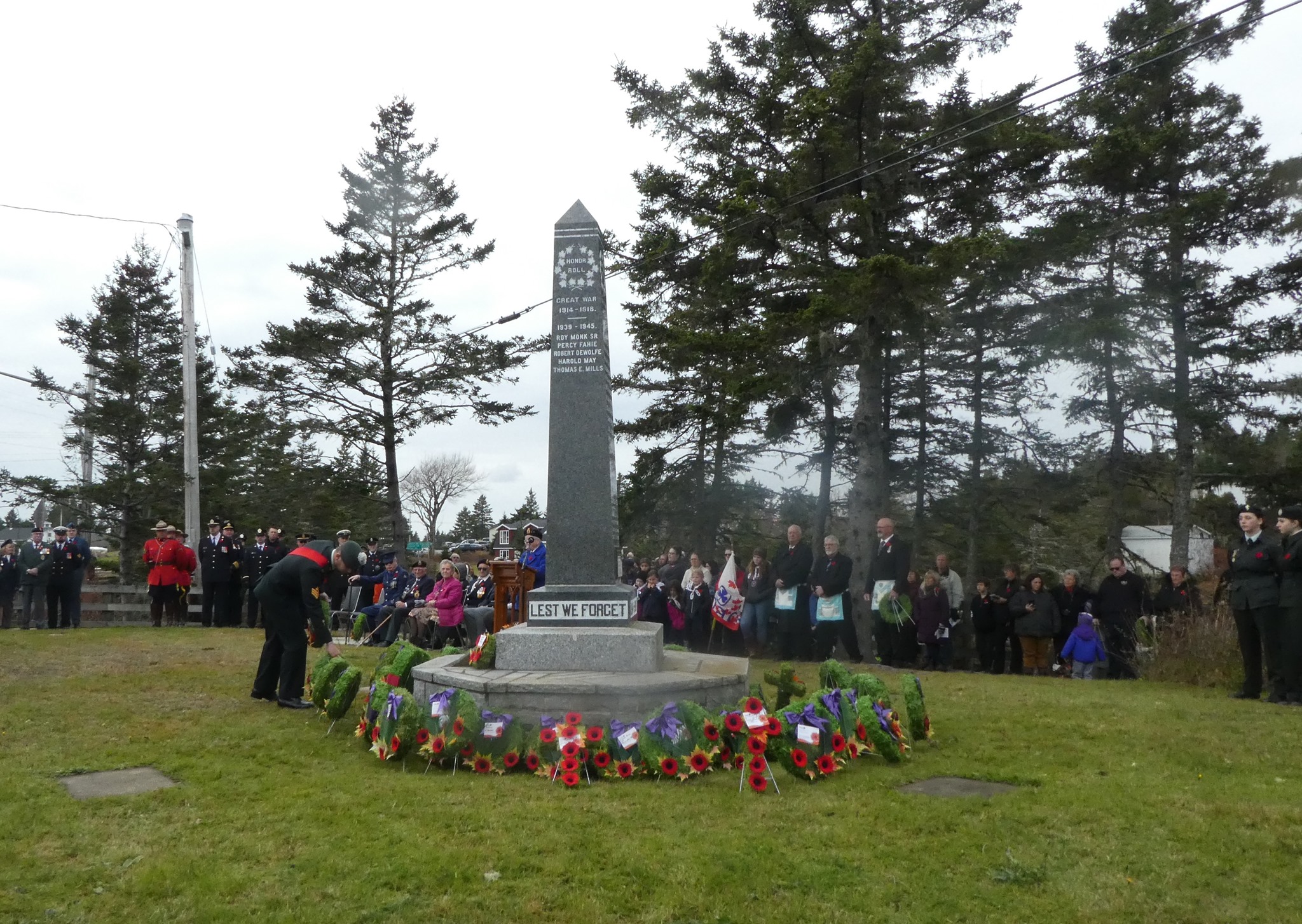 Community remembrance gathering near the memorial in Westphal